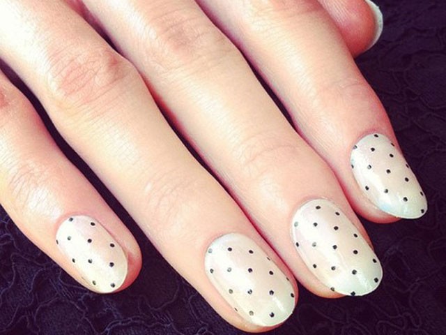 Tiny Black Dots on Cream